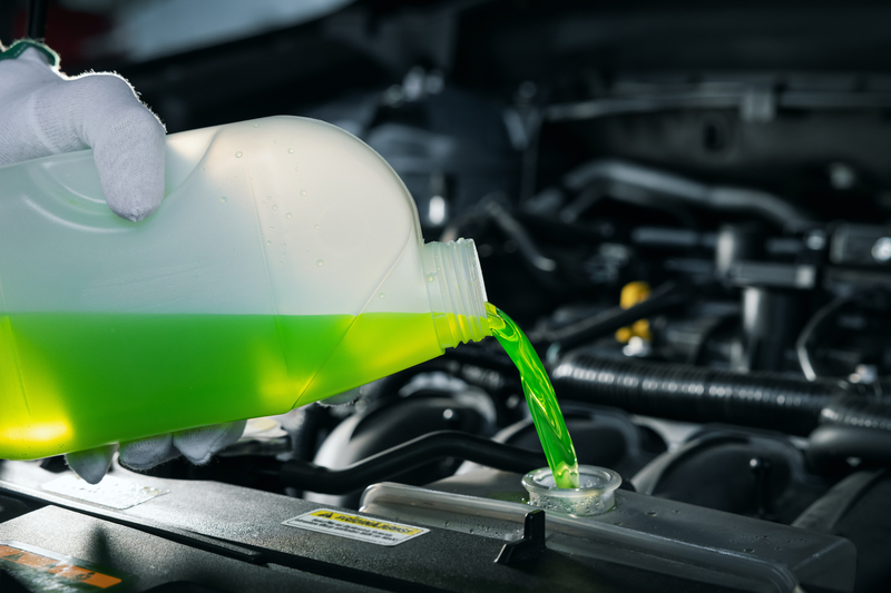 Antifreeze being poured into engine
